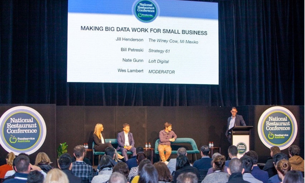 A photo of Jill on a panel speaking at the National Restaurant Conference.