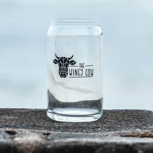 A single beer glass with The Winey Cow logo in black on the front.